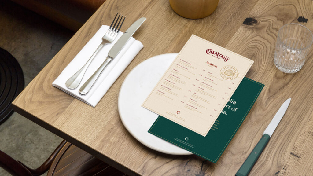 Casa Italia branded restaurant menu on wooden table